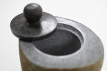 Load image into Gallery viewer, Handcrafted natural stone pet ashes casket up close with lid open.