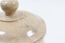 Load image into Gallery viewer, White polished marble pet ashes casket lid close up.
