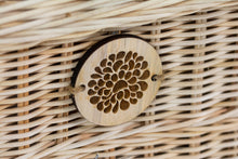 Load image into Gallery viewer, Handwoven rattan pet coffin badge close up.