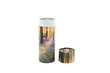 Load image into Gallery viewer, Cylindrical pet ashes scattering tube with a bluebell woodland image, with lid off.