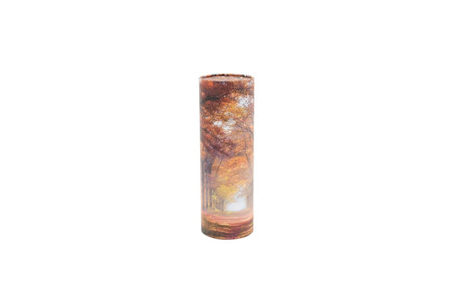 Large cylindrical pet ashes scattering tube with an autumnal woodland image.