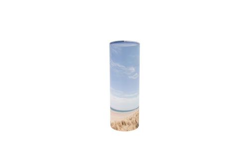 Large cylindrical pet ashes scattering tube with a beach scene image.