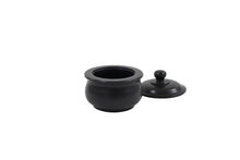 Load image into Gallery viewer, Handcrafted black stone pet ashes casket, with lid open.
