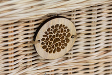 Load image into Gallery viewer, Handwoven rattan pet coffin badge close up.
