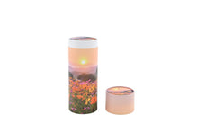 Load image into Gallery viewer, Cylindrical pet ashes scattering tube with a flower meadow image, with lid off.
