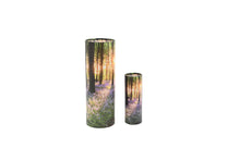 Load image into Gallery viewer, Large and small cylindrical pet ashes scattering tubes with a bluebell woodland image.
